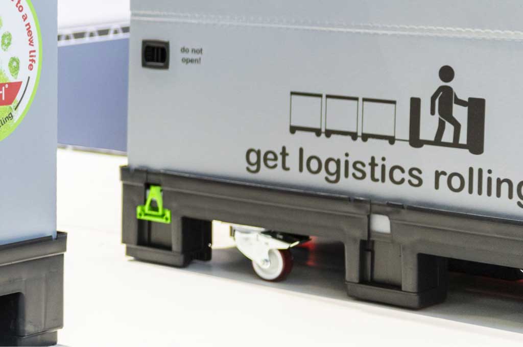 Rolle mit Feststellbremse an der Unterseite eines Containers